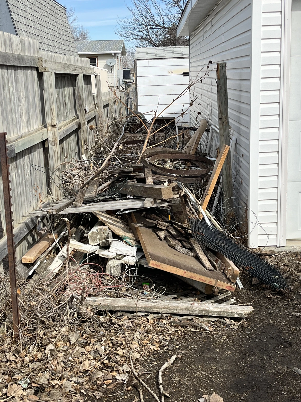 Yard cleanup in Minot, ND — before Dakota Cleanout service