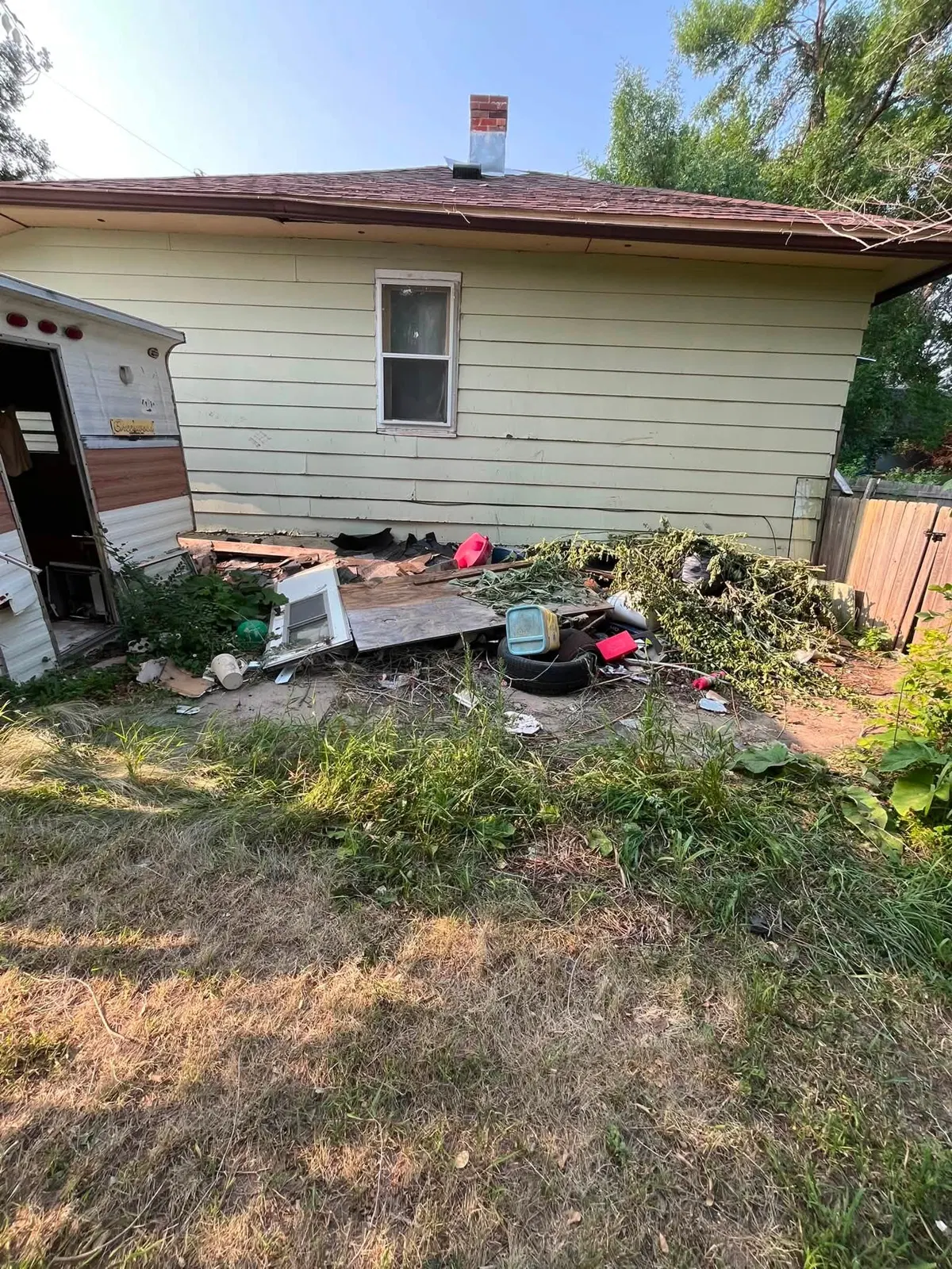 Exterior property cleanup before Dakota Cleanout work