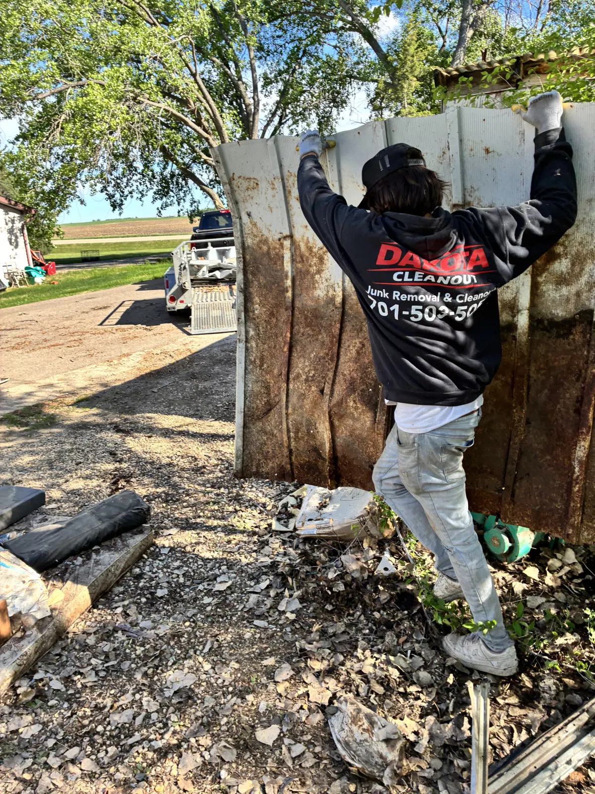 Raj Economy working at a Dakota Cleanout jobsite